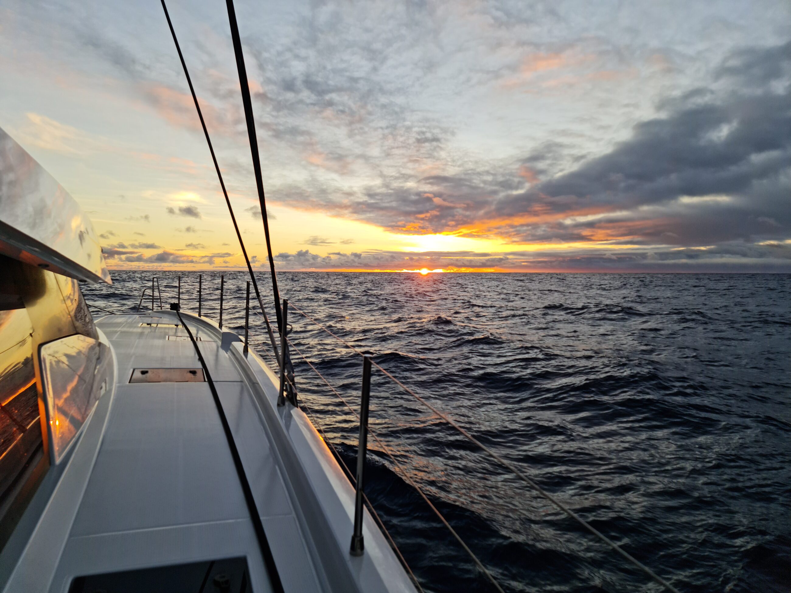 Offshore passage at dusk from the side deck. Working conditions under way